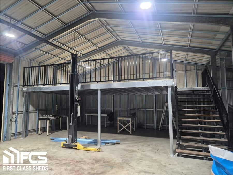 Large dark steel shed with two roller doors