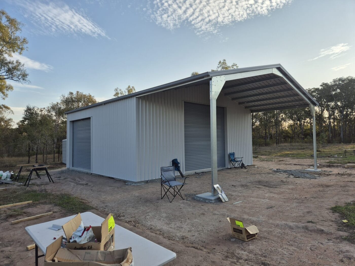 Custom shed with an open awning bay on a rural block